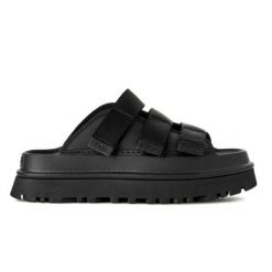 Damskie japonki klapki W GOLDENGLOW SLIDE. Czarne klapki damskie UGG, bez wzorów, z materiału, bez obcasa, bez zapięcia. Za 498.45 zł.