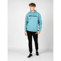 Bluza trekking męska Hoodie. Niebieskie bluzy męskie Champion, m, bez wzorów, z bawełny, bez ramiączek, bez kaptura. Za 208.00 zł.