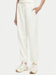 Guess Spodnie dresowe V6YB09 K4292 Kremowy Regular Fit. Białe spodnie dresowe damskie Guess, z aplikacjami, z dresówki. Za 394.99 zł.