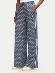 Guess Spodnie dresowe V6YB27 K5181 Granatowy Relaxed Fit. Niebieskie spodnie dresowe damskie Guess, z aplikacjami, z dresówki. Za 474.99 zł.