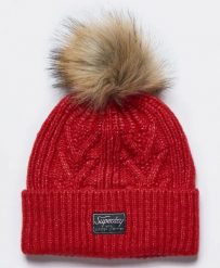 Superdry czapka Cable Lux z warkoczowym splotem i pomponem – Flame Marl. Brązowe czapki damskie Superdry, bez wzorów, z futra. Za 98.60 zł.