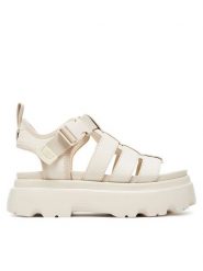 Ugg Sandały W Cora 1152698 Écru. Sandały damskie UGG, bez wzorów, z nubiku, bez obcasa, na płaskiej podeszwie, bez zapięcia. Za 539.99 zł.