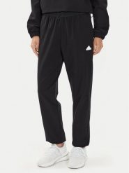 Adidas Spodnie dresowe City Escape IT8814 Czarny Regular Fit. Czarne spodnie dresowe damskie Adidas, bez wzorów, z dresówki. Za 329.99 zł.