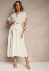 Jasnobeżowa Rozkloszowana Sukienka z Gumką w Talii i Wiązaniem Sepenira. Brązowe sukienki damskie Renee, na co dzień, xs, bez wzorów, z jeansu, eleganckie, bez kołnierzyka, bez ramiączek, maxi, kopertowe. Za 64.99 zł.