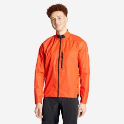 Kurtka przeciwdeszczowa rowerowa MTB Rockrider Comfort 500. Czerwone kurtki męskie ROCKRIDER, l, bez wzorów, z materiału, sportowe, bez kaptura. Za 159.99 zł.