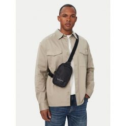 Saszetka piersiowa Calvin Klein. Czarne saszetki i nerki męskie Calvin Klein, małe. Za 249.99 zł.
