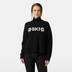 Damski sweter z dzianiny Helly Hansen Bliss. Czarne swetry nierozpinane damskie Helly Hansen, na zimę, bez wzorów, z dzianiny, sportowe, bez kołnierzyka, bez ramiączek. Za 701.00 zł.