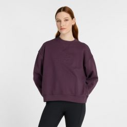 Bluza damska New Balance WT43535PLN – fioletowa. Fioletowe bluzy damskie New Balance, xs, bez wzorów, z bawełny, klasyczne, bez ramiączek, bez kaptura. Za 199.99 zł.