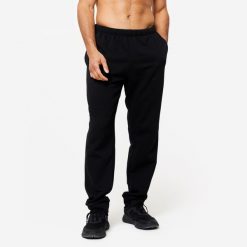 Spodnie dresowe męskie Domyos Gym & Pilates 100. Czarne spodnie sportowe męskie DOMYOS, l, bez wzorów, z bawełny, na fitness i siłownię. Za 49.99 zł.