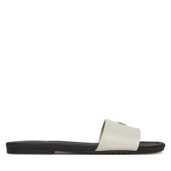 Klapki Calvin Klein Jeans. Białe klapki damskie Calvin Klein Jeans, bez wzorów, z jeansu, bez obcasa, bez zapięcia. Za 209.99 zł.