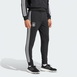 Spodnie dresowe Germany DNA. Czarne spodnie sportowe męskie Adidas, s, bez wzorów, z dresówki, do piłki nożnej. W wyprzedaży za 250.30 zł.