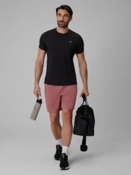 4F Spodenki treningowe szybkoschnące męskie - koralowe L. Pomarańczowe szorty męskie 4F, bez wzorów, z materiału. Za 149.99 zł.