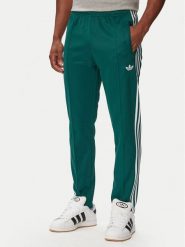 Adidas Spodnie dresowe Beckenbauer KE1668 Zielony ciemny Regular Fit. Zielone spodnie sportowe męskie Adidas, m, bez wzorów, z dresówki. Za 237.99 zł.