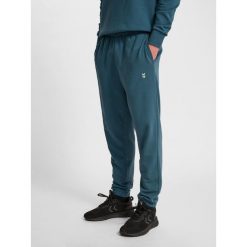 Spodnie dresowe Hummel Pulse. Niebieskie spodnie sportowe męskie Hummel, l, bez wzorów, z dresówki, na fitness i siłownię. Za 155.00 zł.