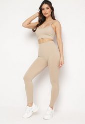 Beżowy Komplet Sportowy Biustonosz na Ramiączkach i Legginsy z Gumką w Pasie Nadlira. Brązowe legginsy damskie Born2be, m, bez wzorów, na fitness i siłownię. Za 79.99 zł.