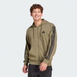 Bluza z kapturem Essentials 3-Stripes French Terry Full-Zip. Brązowe bluzy męskie Adidas, m, bez wzorów, z materiału, z kapturem, na fitness i siłownię. Za 279.00 zł.
