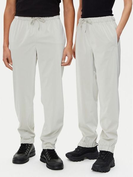 Rains Spodnie przeciwdeszczowe Unisex 18560 Beżowy Regular Fit. Brązowe spodnie sportowe damskie Rains, bez wzorów, z syntetyku, sportowe, żeglarskie. Za 169.99 zł.