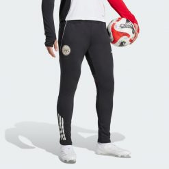 Spodnie treningowe Ajax Amsterdam Tiro 25 Competition. Białe spodnie sportowe męskie Adidas, s, bez wzorów, z dresówki, na fitness i siłownię. Za 279.00 zł.