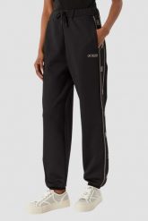 GUESS Czarne damskie spodnie dresowe z lampasami i cyrkoniami Octavia, Rozmiar L. Czarne spodnie sportowe damskie Guess, z aplikacjami, z dresówki, sportowe. Za 599.99 zł.