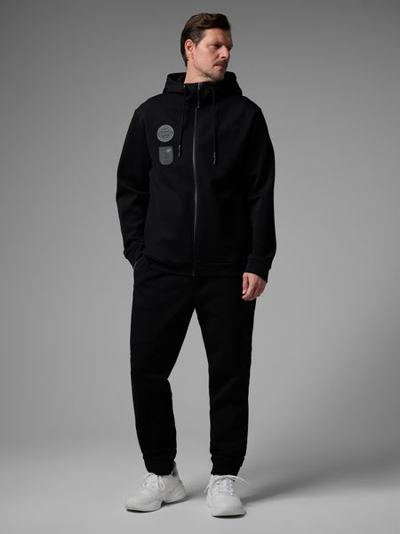 4F Spodnie dresowe joggery męskie 4F x Robert Lewandowski - czarne XXL. Czarne spodnie materiałowe męskie 4F, bez wzorów, z bawełny. Za 189.99 zł.