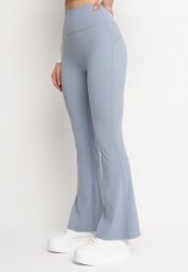 Jasnoniebieskie Legginsy o Kroju Dzwonów z Wysokim Stanem Koritea. Niebieskie legginsy damskie Born2be, bez wzorów, z jeansu. Za 39.99 zł.