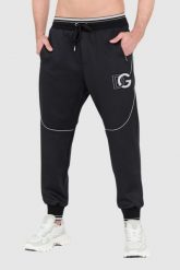 DOLCE & GABBANA Czarne spodnie dresowe z dużym logo. Czarne spodnie sportowe męskie Dolce and Gabbana, m, bez wzorów, z dresówki. W wyprzedaży za 2,499.99 zł.