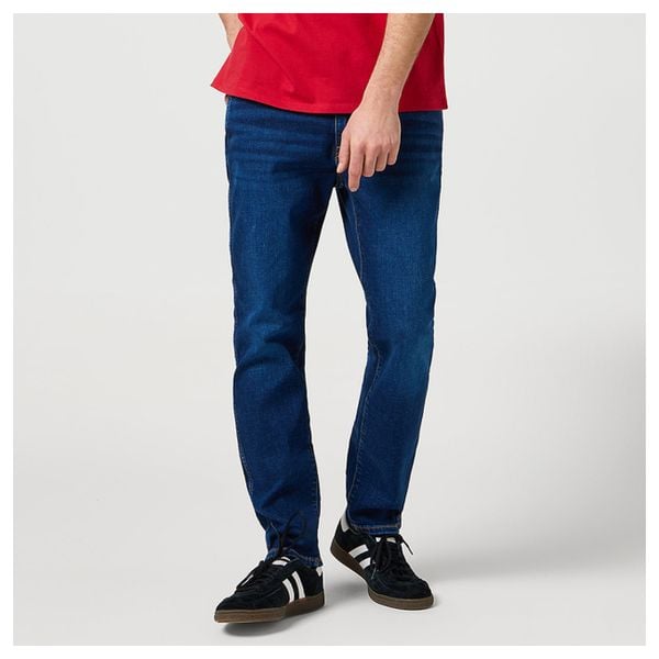 WRANGLER MĘSKIE SPODNIE JEANSOWE WRANGLER LARSTON VINTAGE STORM 112368466. Jeansy męskie Wrangler, z jeansu, vintage. Za 209.99 zł.