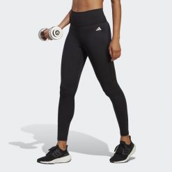 Legginsy treningowe z wysoką talią damskie 7/8 adidas Essentials. Czarne legginsy damskie Adidas, bez wzorów, z materiału. Za 199.00 zł.