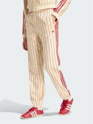 Adidas Spodnie dresowe 165364 Żółty Regular Fit. Żółte spodnie dresowe damskie Adidas, bez wzorów, z dresówki. Za 399.99 zł.