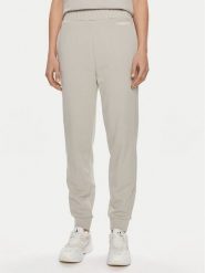 Calvin Klein Spodnie dresowe Micro Logo K20K206632 Beżowy Regular Fit. Brązowe spodnie dresowe damskie Calvin Klein, bez wzorów, z bawełny. Za 359.99 zł.