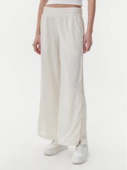 Puma Spodnie dresowe Ess 629804 Beżowy Wide Leg. Brązowe spodnie dresowe damskie Puma, bez wzorów, z dresówki. Za 219.99 zł.