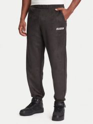 Guess Spodnie dresowe Z5YB03 KCJY2 Zielony Regular Fit. Zielone spodnie sportowe męskie Guess, m, z aplikacjami, z bawełny. Za 309.99 zł.