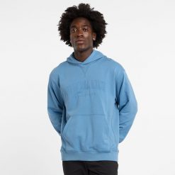 Bluza męska New Balance MT43500HEB – niebieska. Niebieskie bluzy męskie New Balance, l, z aplikacjami, z bawełny, z kapturem. Za 199.99 zł.