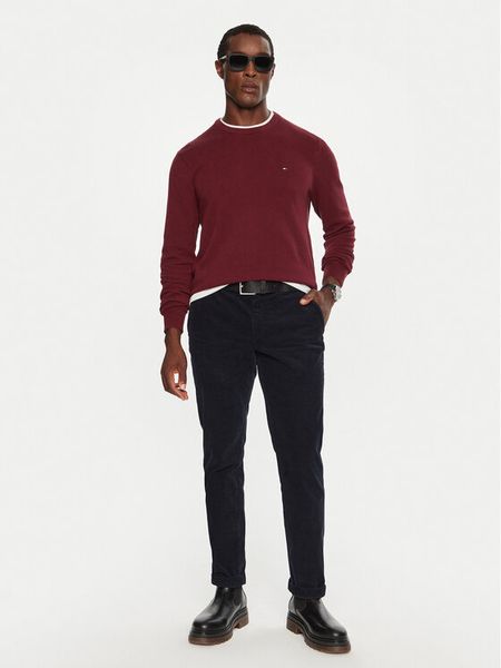 Tommy Hilfiger Spodnie materiałowe MW0MW32932 Granatowy Regular Fit. Niebieskie spodnie materiałowe męskie Tommy Hilfiger, bez wzorów, z materiału. Za 349.99 zł.