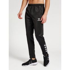 Spodnie do biegania Hummel Core XK Poly. Czarne spodnie dresowe damskie Hummel, bez wzorów, sportowe. Za 203.50 zł.
