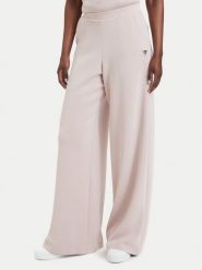Guess Spodnie dresowe V4YB07 KCAY2 Różowy jasny Relaxed Fit. Czerwone spodnie dresowe damskie Guess, z aplikacjami, z dresówki. Za 394.99 zł.