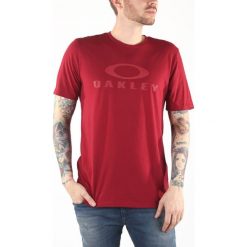 Oakley Koszulka Czerwony. Czerwone t-shirty męskie Oakley, m, bez wzorów, z bawełny, bez kołnierzyka, bez ramiączek. Za 119.95 zł.