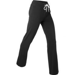 Spodnie z dżerseju z bawełny ze stretchem. Czarne spodnie sportowe damskie bonprix, bez wzorów, z bawełny, sportowe, na fitness i siłownię. Za 77.99 zł.