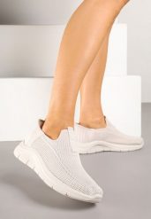 Jasnobeżowe Wsuwane Buty Sportowe Sneakersy na Tłoczonej Podeszwie Fadema. Brązowe obuwie sportowe damskie Born2be, bez wzorów, bez zapięcia. Za 69.99 zł.