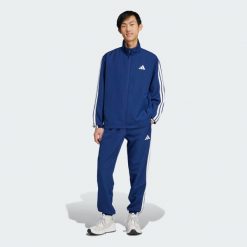 Dres Sportswear Basic 3-Stripes Woven. Niebieskie komplety dresowe męskie Adidas, xs, bez wzorów, z dresówki. Za 299.00 zł.
