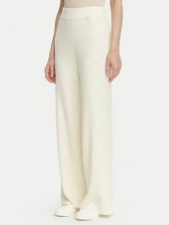Guess Spodnie dzianinowe O6BB01 Z1147 Kremowy Regular Fit. Białe spodnie materiałowe damskie Guess, z aplikacjami, z dzianiny. Za 344.99 zł.