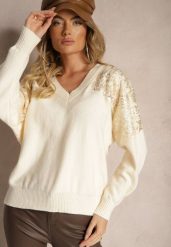 Jasnobeżowy Sweter o Kroju Nietoperza Ozdobiony Cekinami i Cyrkoniami Nevarraea. Brązowe swetry nierozpinane damskie Renee, z aplikacjami, z jeansu, casualowe, bez kołnierzyka, bez ramiączek. Za 119.99 zł.