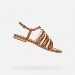 Sandały GEOX D MADDALUSIAC Brązowy. Brązowe sandały damskie Geox, bez wzorów, ze skóry, bez obcasa, bez zapięcia. Za 315.99 zł.