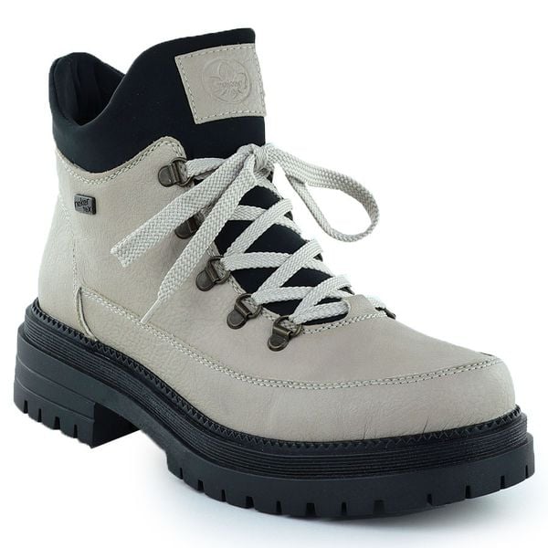 Botki damskie traperki na suwak beżowe Rieker Y3158-60. Brązowe trapery damskie Rieker, ze skóry ekologicznej, bez zapięcia. Za 389.00 zł.