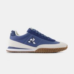 Sneakersy Le Coq Sportif Veloce. Niebieskie buty sportowe męskie le coq sportif, bez wzorów, bez zapięcia. Za 412.50 zł.