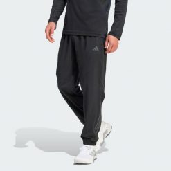 Spodnie Dresowe Tech Essentials Workout. Czarne spodnie sportowe męskie Adidas, bez wzorów, z dresówki, na fitness i siłownię, climacool (adidas). Za 279.00 zł.