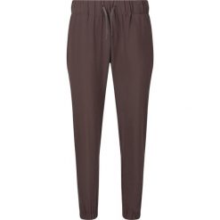 Damskie spodnie dresowe Athlecia Austberg. Brązowe spodnie dresowe damskie Athlecia, bez wzorów, z dresówki, sportowe. Za 196.50 zł.