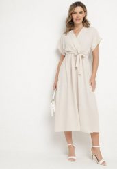 Jasnobeżowa Sukienka o Rozkloszowanym Kroju z Wiązanym Paskiem Sepelina. Brązowe sukienki damskie Born2be, na co dzień, na lato, s, bez wzorów, eleganckie, bez kołnierzyka, bez ramiączek, maxi, kopertowe. Za 69.99 zł.