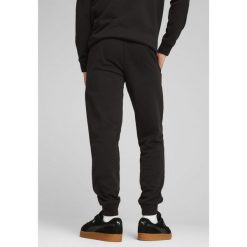 Męskie spodnie dresowe Essentials z logo No. 1 PUMA Black. Czarne eleganckie spodnie męskie Puma, l, bez wzorów, z dresówki, na fitness i siłownię. Za 149.00 zł.