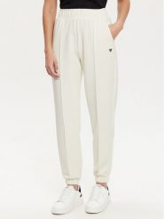Guess Spodnie dresowe V5RB11 KCAY2 Écru Regular Fit. Spodnie dresowe damskie Guess, z aplikacjami, z dresówki. Za 249.99 zł.